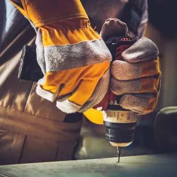 Exterior view of a modern two-story luxury home under construction with stone and stucco finishes, representing high-end residential building by Best Construction LA.