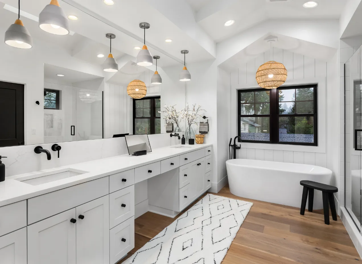 Luxury bathroom remodeling project in Los Angeles featuring double vanity, freestanding bathtub, and modern lighting.