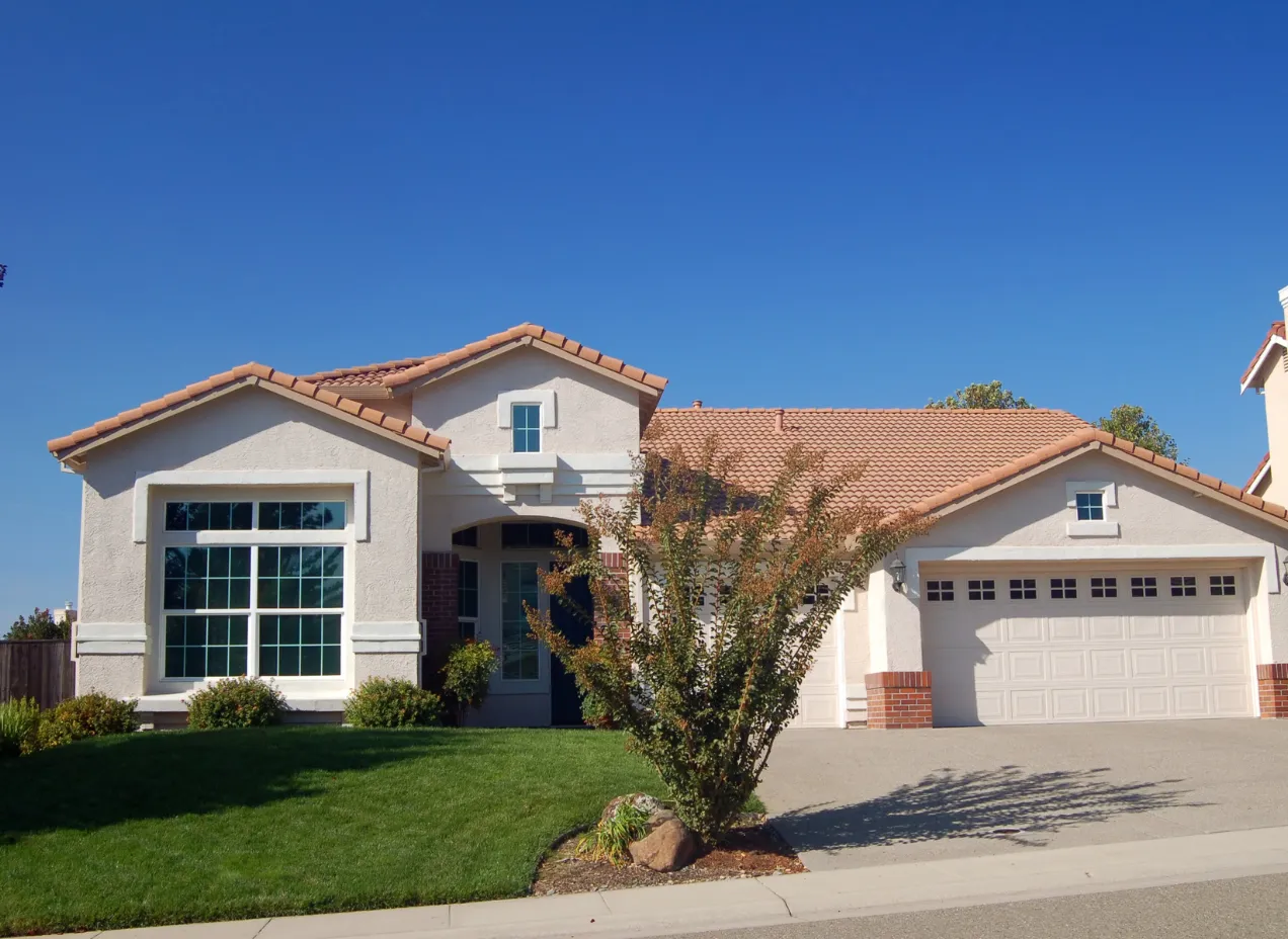 New home construction project in Los Angeles showing completed residential house with modern exterior design and attached garage.