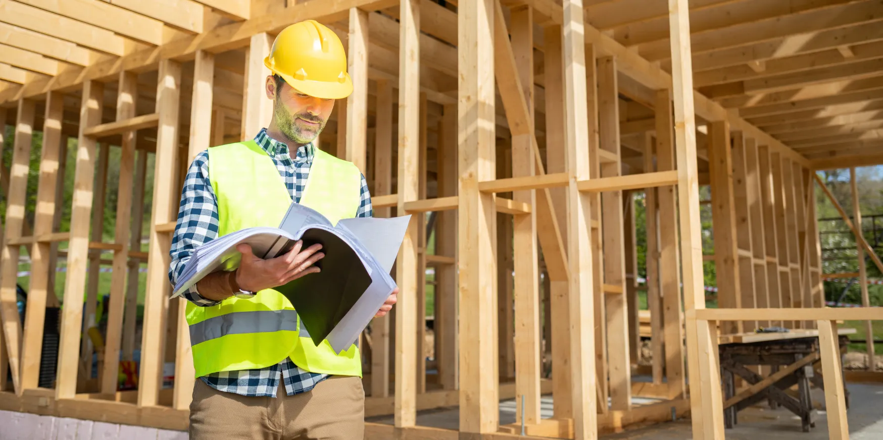 General contractor in Los Angeles managing residential construction project and reviewing building plans