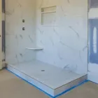 Bathroom remodeling project in Los Angeles with walk-in shower and tile installation