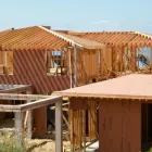 New home construction in Los Angeles showing wood framing structure during early building phase